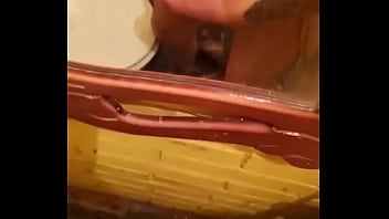 A guy relieves his stress by jerking his dick off in the bathroom