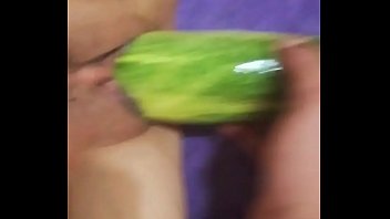 Excited Croatian woman fucks herself with a thick cucumber in her vagina